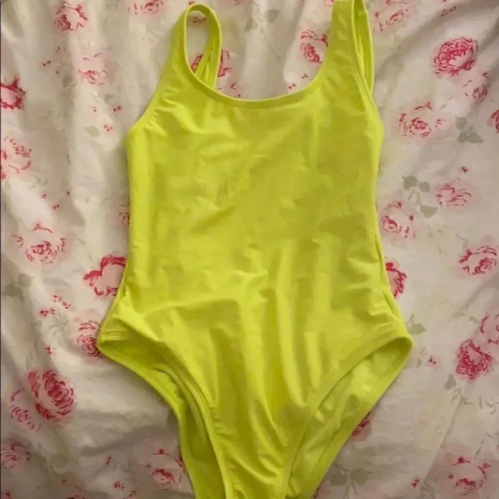 Neon yellow new one piece bathing suit open back